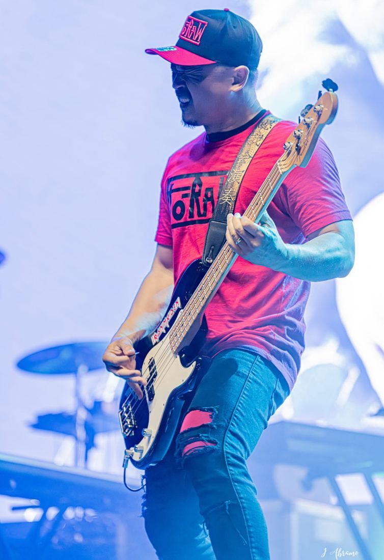 Bobby on bass in a FLO-RAW shirt